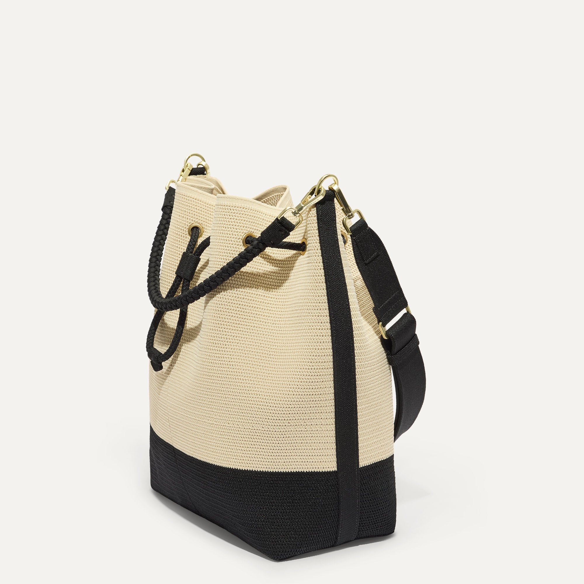 468_CinchBucketBag_Black_WhiteRaffia-Knit_Strap45Degree_6890.jpg
